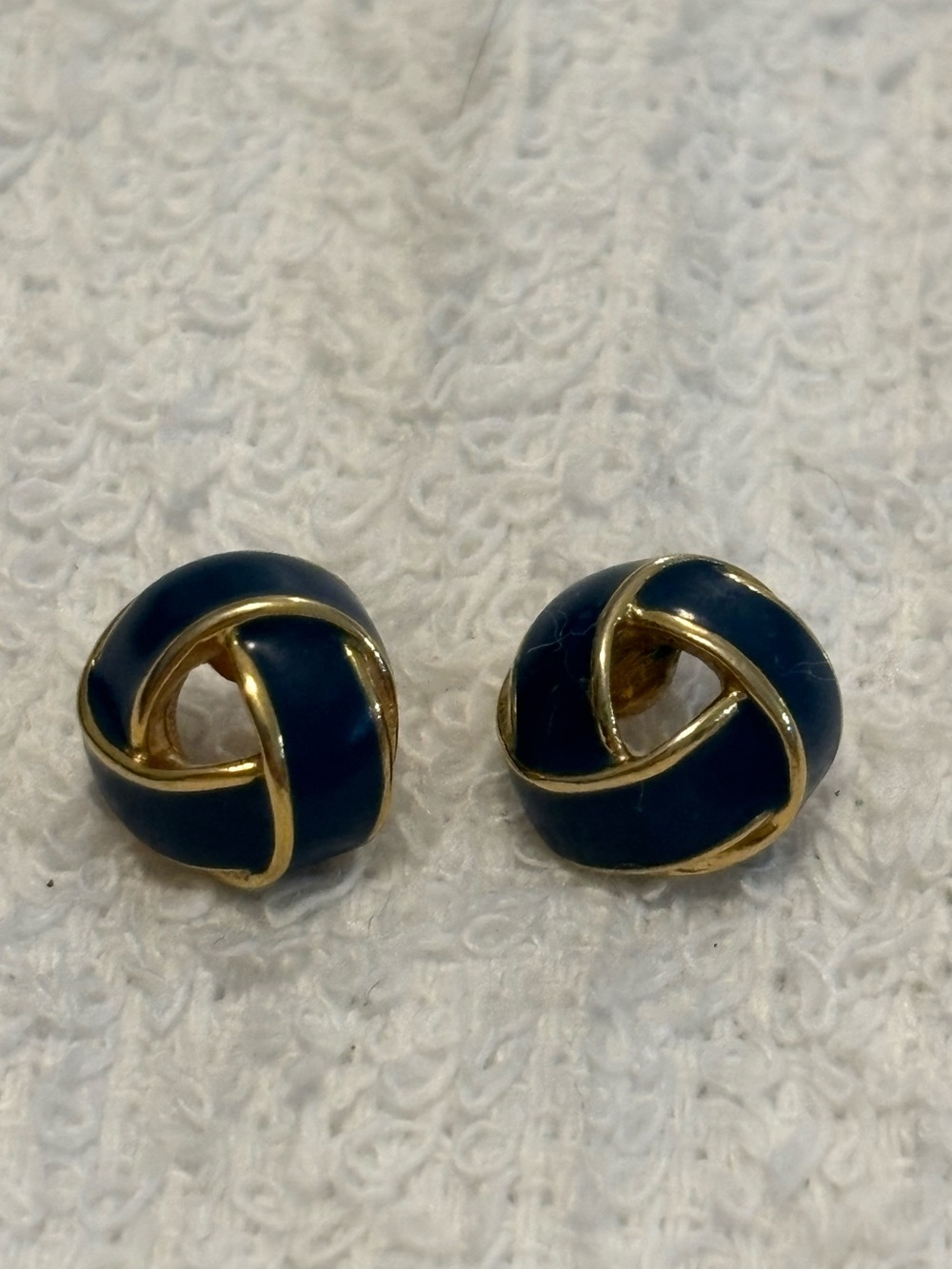 Monet Navy blue enamel and gold tone love knot earrings